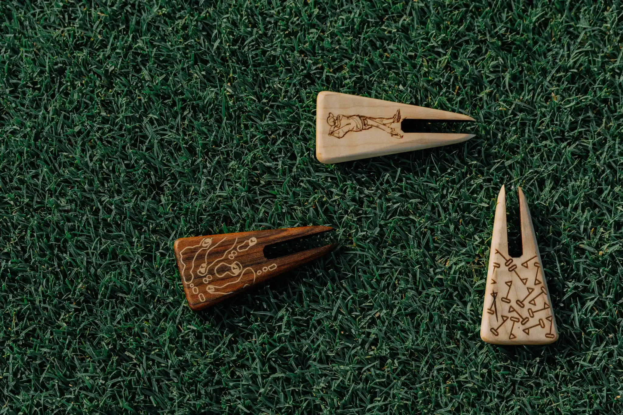 Golf course background with premium divot tools